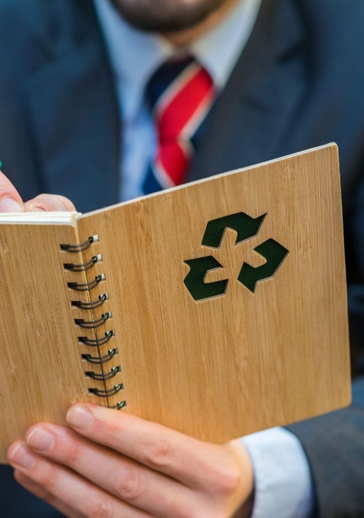 Employee filling in a recyled book