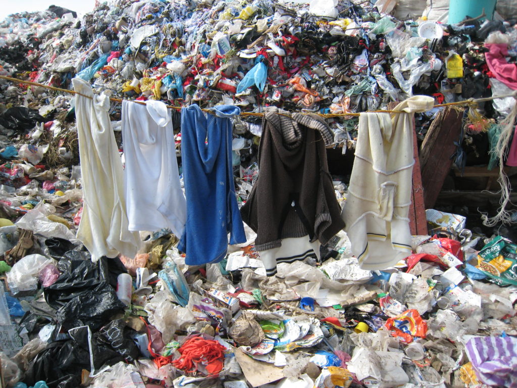 Clothes on rubbish dump